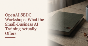 Cover reading OpenAI SBDC Workshops: What the Small-Business AI Training Actually Offers, beside a notebook with a copper clip on an oak desk